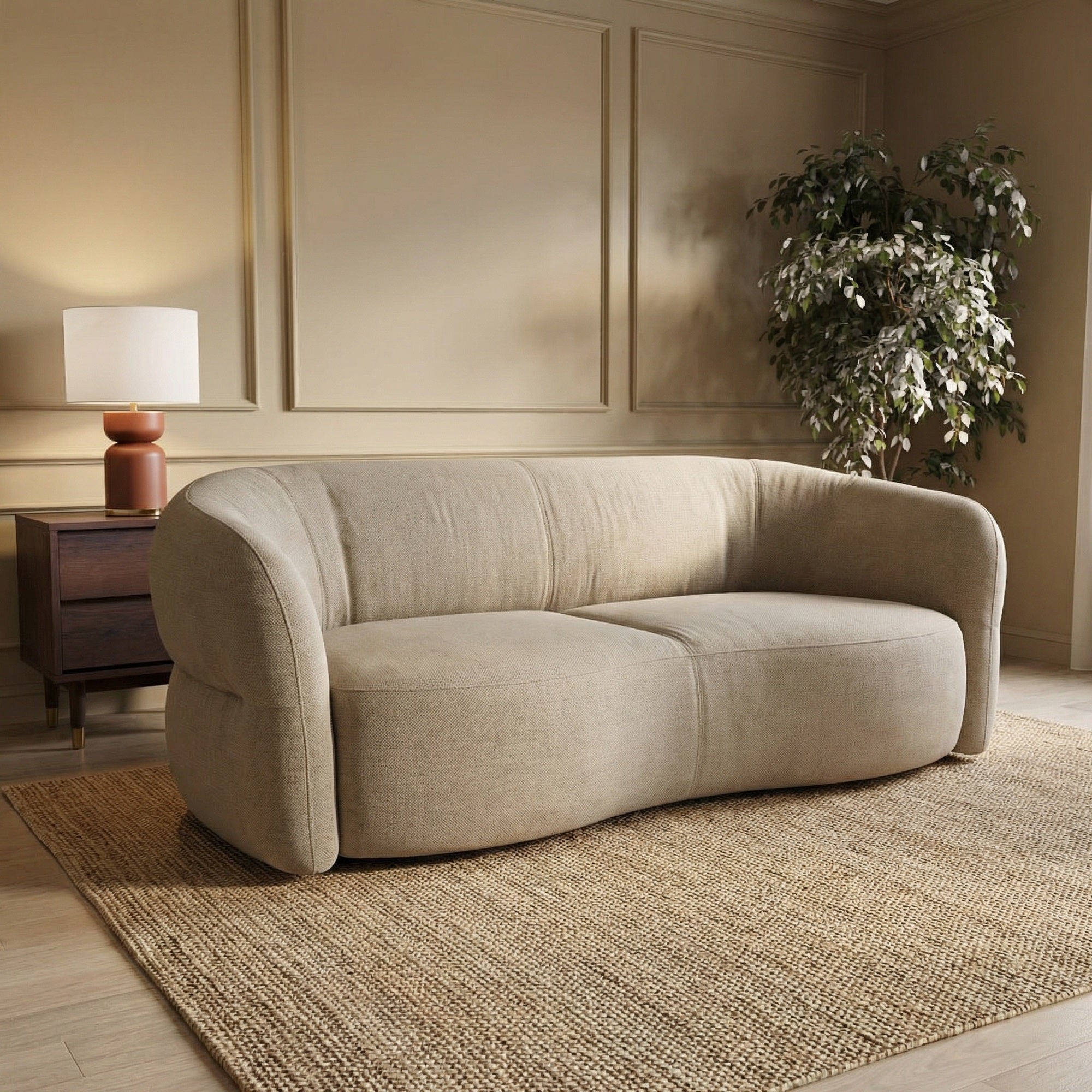A beige fabric sofa with curving sides and curved seats