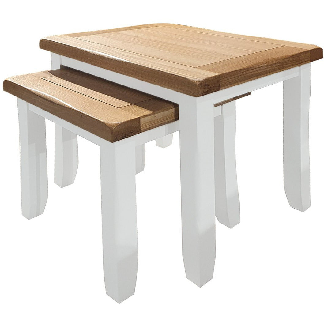 white nest of tables with oak tops